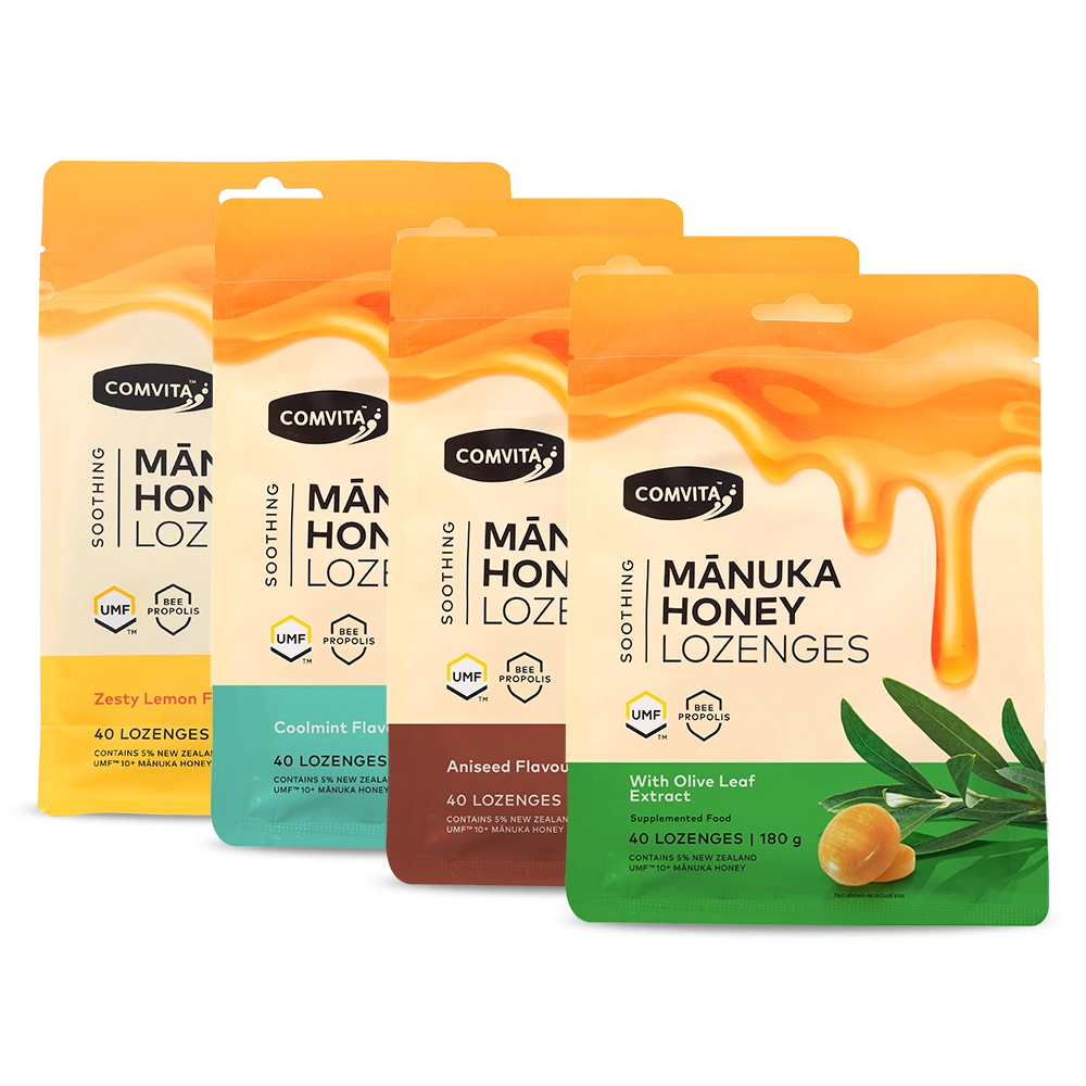 Four packages of Comvita Manuka Honey Lozenges on a white background