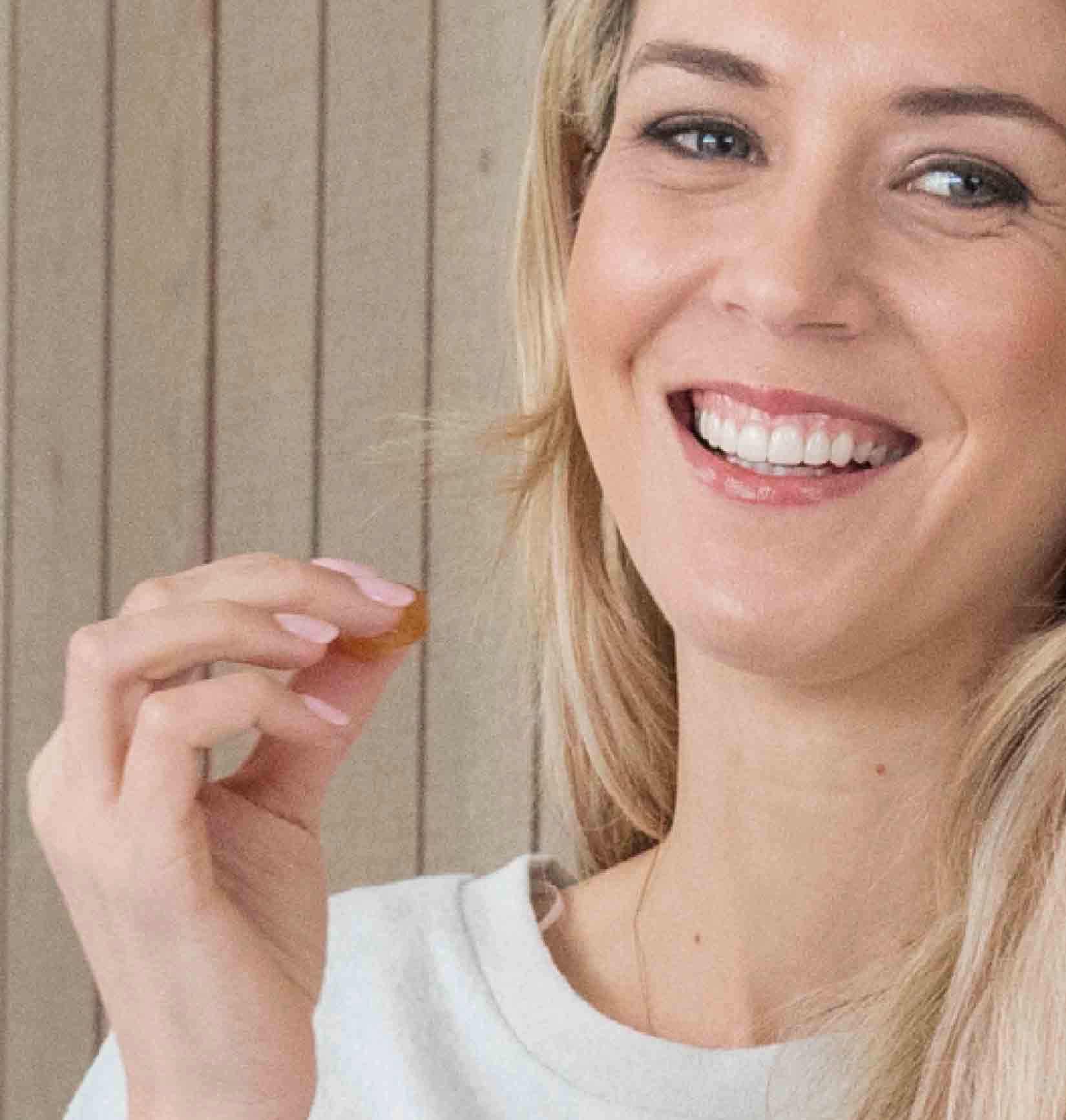 Lady eating a lozenge