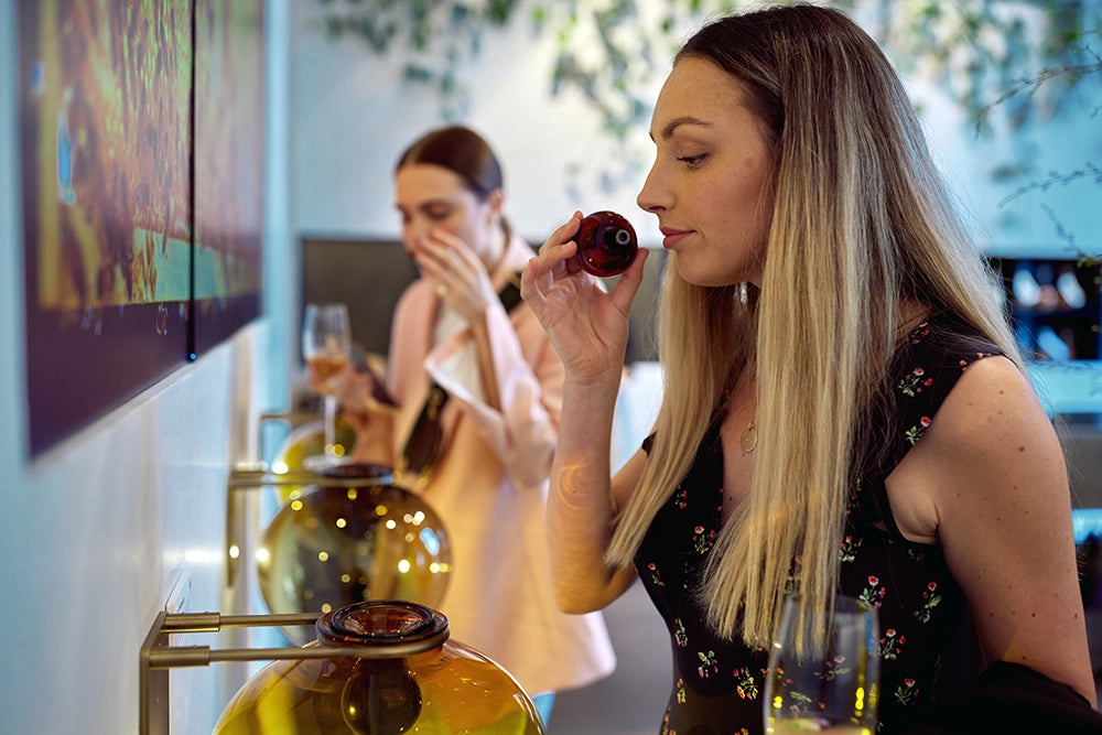 women smelling the sent of manuka