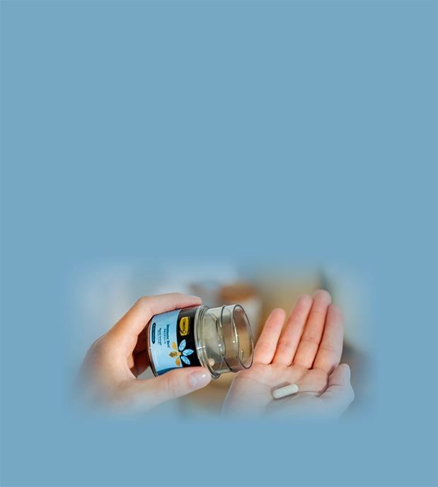 hand holding propolis PFL15 regular strength capsules