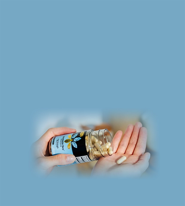 hand holding propolis high strength pfl30 capsules