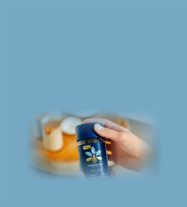 hand holding propolis pfl60 ultra strength capsules