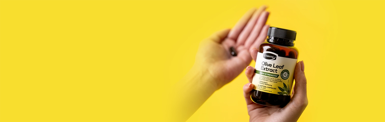 hand holding olive leaf extract high strength capsules
