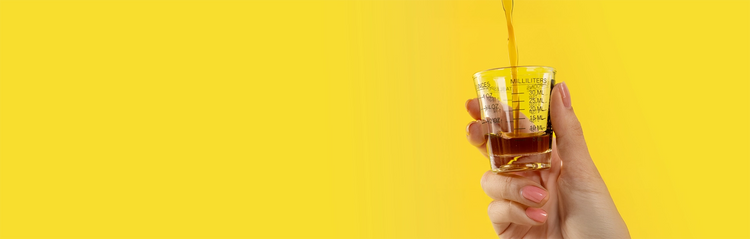 hand holding olive leaf extract liquid