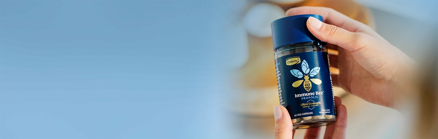 hand holding propolis pfl60 ultra strength capsules