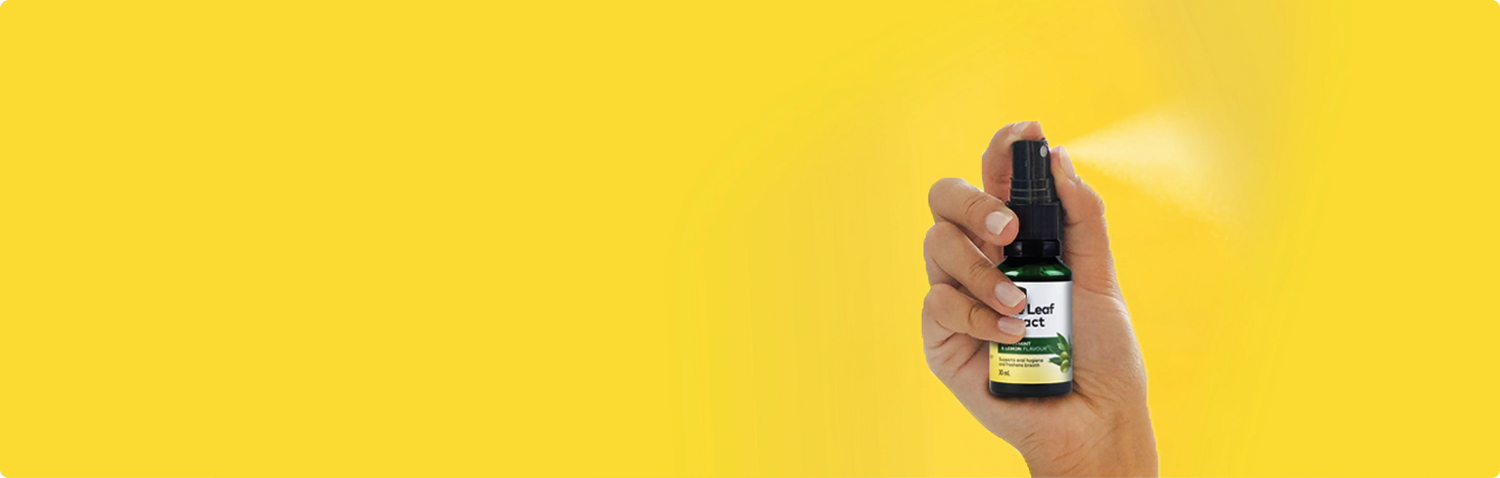 hand holding olive leaf extract oral spray